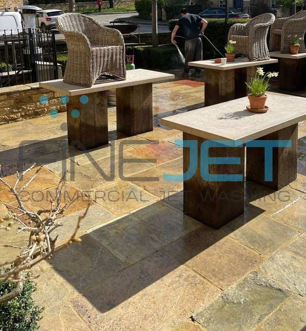 Stone patio area cleaned at popular pub in Kingham, Oxfordshire